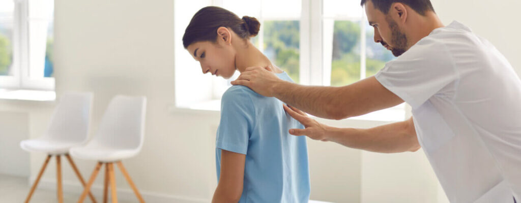 A practitioner diagnosing for back pain